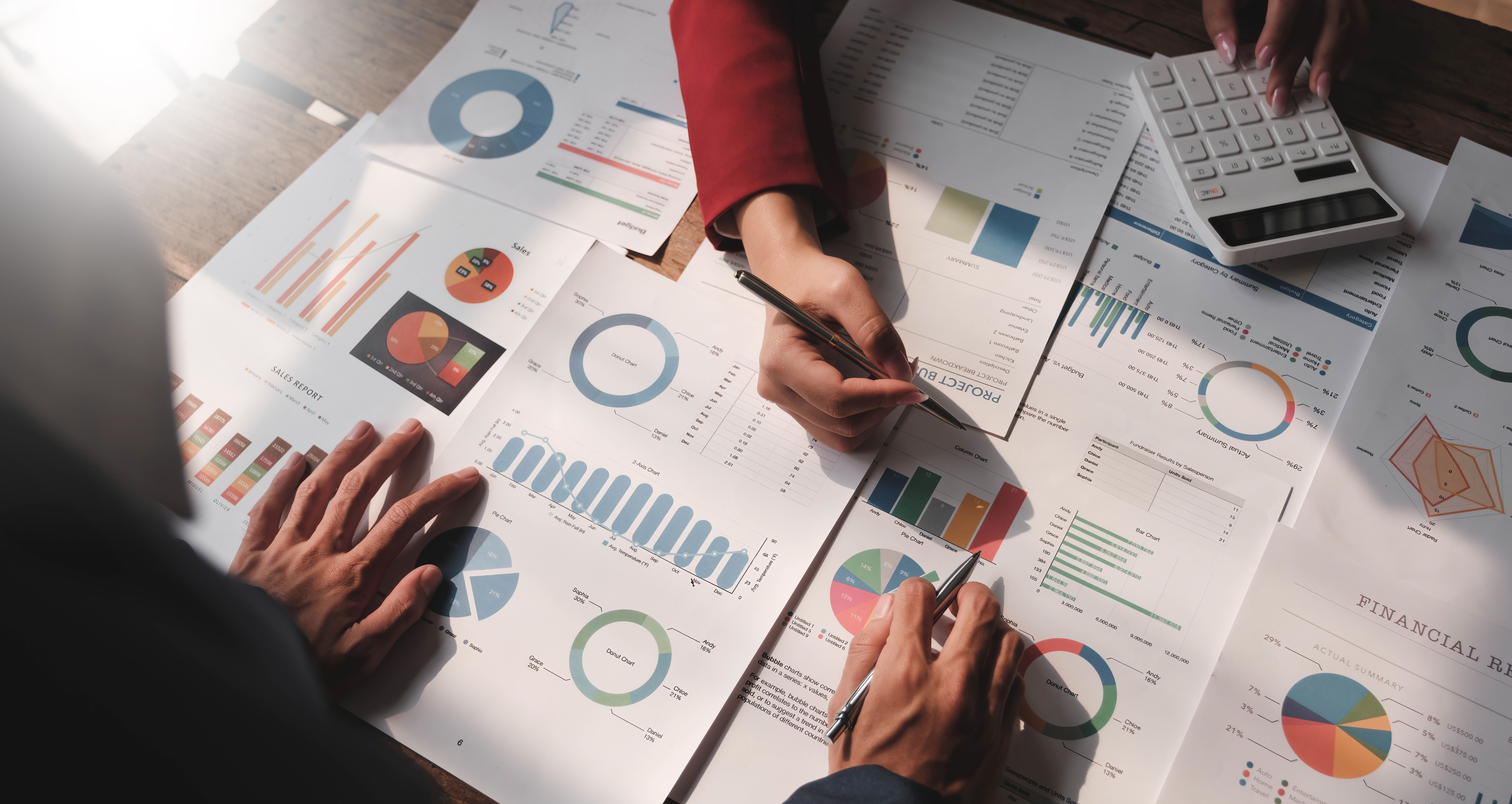 Two professionals examining financial reports, focusing on IFRS disclosure requirements in a modern office setting.